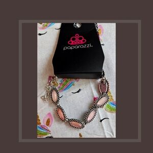 PAPARAZZI Bracelet Accented with Pink stones.